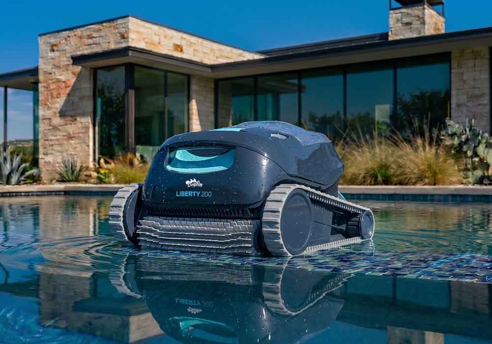 Dolphin Liberty 200 surfacing at the edge of a backyard pool
