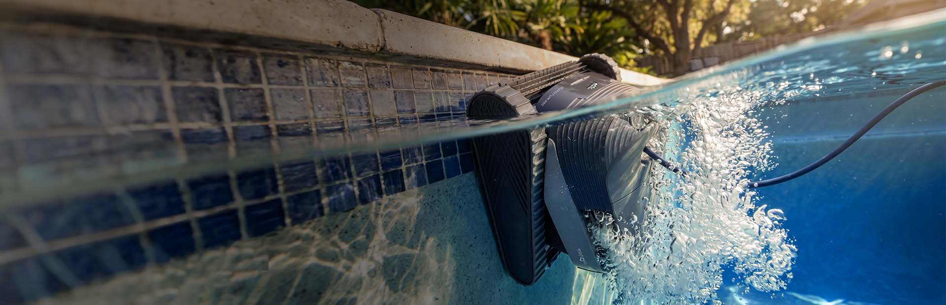 Dolphin Quantum Pro cleaning along the pool waterline